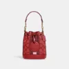 Coach Mini Dempsey Bucket Bag In Signature Jacquard With Stripe And Coach Patch Red Apple Multi