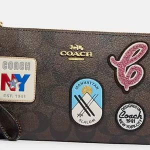 Coach Large Corner Zip Wristlet In Signature Canvas With Ski Patches Brown Black Multi