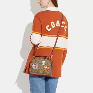 Coach X Peanuts Lunch Pail In Signature Canvas With Patches Khaki Redwood Multi
