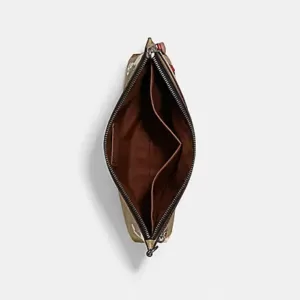 Coach X Peanuts Carry All Pouch In Signature Canvas With Snoopy Woodstock Print